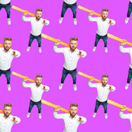 Pattern. High angle view of funny bearded man, builder, designer or architect with equipment isolated on lilac color background.の写真素材