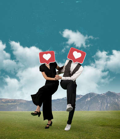 Contemporary art collage of couple with like icons head dancing isolated over nature, mountain backgroundの写真素材