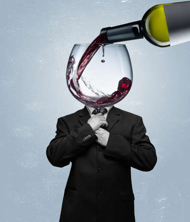 Contemporary art collage, modern design. Retro style. Man headed with red wine glass on blue backgroundの写真素材