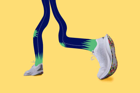 Contemporary artwork. Drawn female legs wearing sneakers, trainers running isolated on yellow neon color background.の写真素材