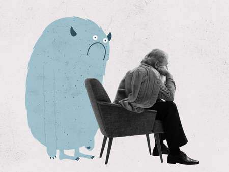 Offended sad elderly man sitting on armchair and cute drawn cartoon little man-blot on pastel background with dust effectの写真素材