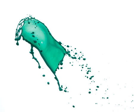 Splashes of green color paint isolated on white background with copy space for ad, text, designの写真素材