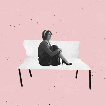 Contemporary art collage of woman in vintage suit sitting on paper bench isolated over pink background. Grunge effectの写真素材