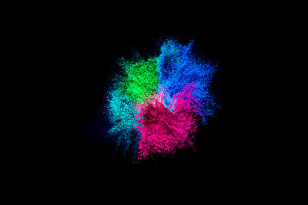 Explosion of colored, fluid and neoned powder on black studio background with copy space. Magazine...