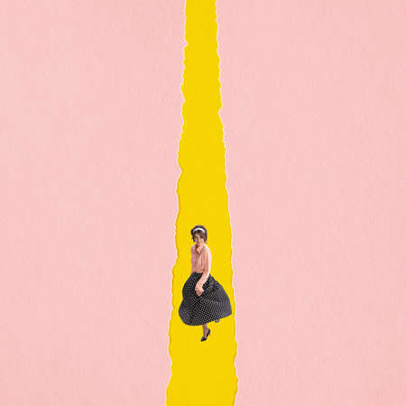 Young woman wearing retro style attire isolated on yellow pink background. Contemporary art collage.の写真素材