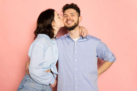 Married couple of young and happy man and woman isolated on pink trendy color background. Human emotions, youth, love and lifestyle conceptの写真素材