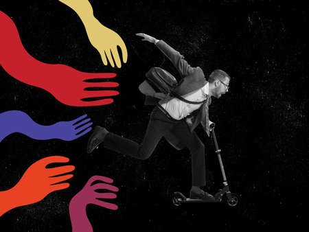 Scared young man, business man running away from giant drawn colored creeping arms. Contemporary art collage. Concept of manipulation or addictionの写真素材