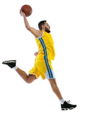One professional basketball player practicing isolated on white studio background. Sport, motion,...