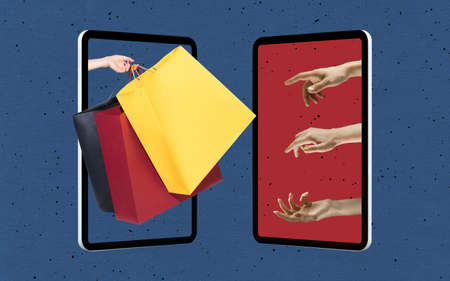 Female hands sticking out tablet screen and making online shopping isolated over blue background....