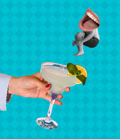 Young man jumping in alcohol cocktail glass isolated on blue background. Conceptual, contemporary bright art collage. Surrealismの写真素材