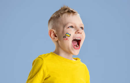 Conceptual collage with crying little boy, kid shouting isolated on blue background. Concept of...