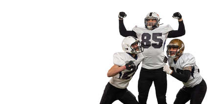 Winner emotions. Three young sportive men, professional american football players in sports uniform...