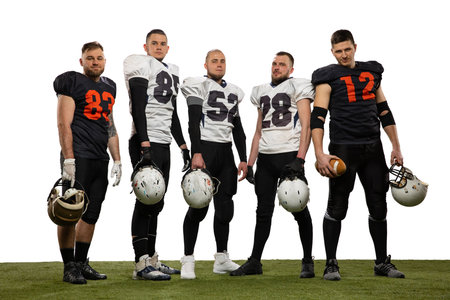 Group of young sportive men, professional american football players in sports uniform and equipment...