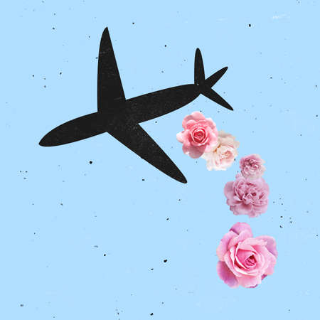 Contemporray art collage. Black plane flying over blue background with pink flowers falling downの写真素材