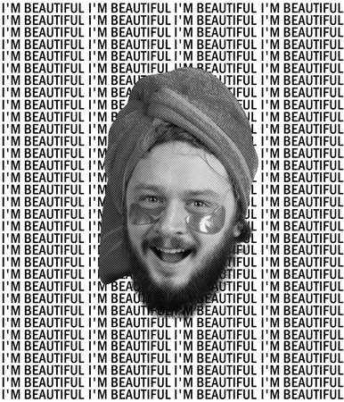 Creative design. Cheerful happy man with towel on head and patches under the eyes smiling at camera isolated over black and white background with letteringの写真素材
