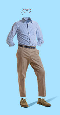Creative portrait of invisible man wearing modern business style outfit and eyeglasses against blue...