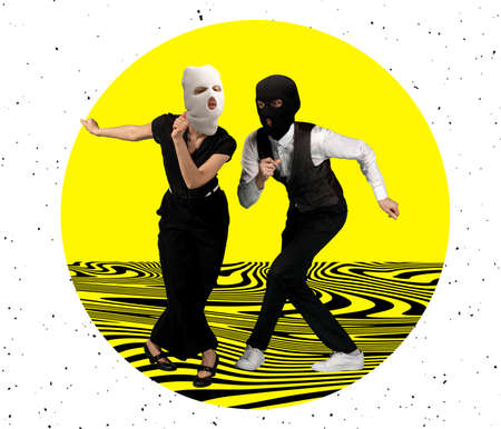 Contemporary art collage. Young stylish couple, man and woman wearing balaclavas and dancing isolated over yellow backgroundの写真素材