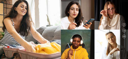 Women, friends having online video call, helping to pack suitcase for travelling.の写真素材