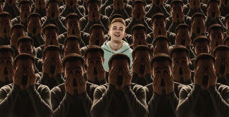 Conceptual creative collage with grey crowd of identical people and special one man standing among them. Difference and diversity concept.の写真素材