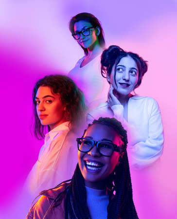 Poster with for beautiful girls isolated on lilac color background in neon light, filter. Concept of emotions, youth, fashion, musicの写真素材