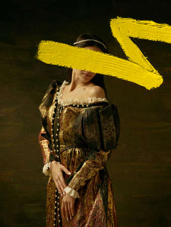 Creative artwork. Portrait of girl in image of medieval princess or countess with yellow stroke of...