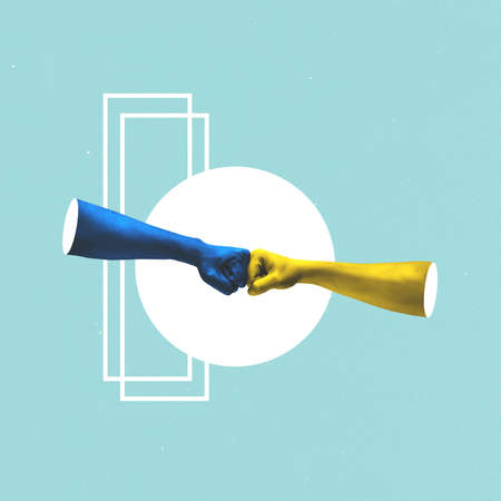 Blue and yellow painted human hands, fists touch each other isolated on blue background. Concept of contemporary art, creativity, diversity, care, support and ad. Symbolismの写真素材