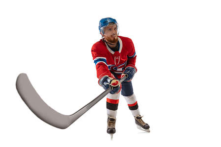 Young male hockey player in sports uniform and protective equipment training isolated on white background. Concept of sport, healthy lifestyle, motion, movement, action.の写真素材
