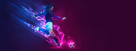 Flyer. Creative artwork with female soccer, football player in motion and action with ball isolated on dark background with polygonal and fluid neon elements.の写真素材