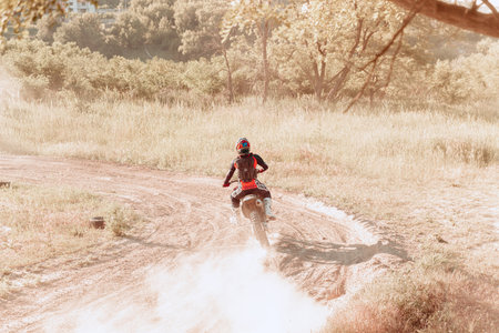 Ukrainian professional motorcycle rider driving on Enduro motorbike, outdoors at hot summer day. Motocross sportのeditorial素材
