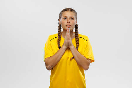 Portrait of young sensual woman in yellow football kit supports favorite soccer team. National fans, competition, sport, oktoberfest conceptの写真素材