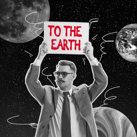 Serious man holding sign over his head isolated over dark space with planets background. Concept of...