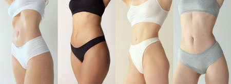 Cropped images of sportive bodies, bellies and breasts of young women in underwear isolated on grey...