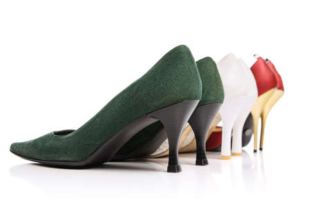 Back view of three pairs of womans vintage style footwear. High-heeled shoes isolated on white background. Concept of art, ad , 60s, 70s retro style fashion. Timeless classicの写真素材