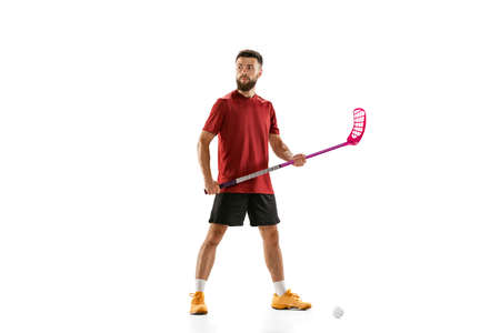 Portrait of young man, floorball player with floorball stick isolated on white background. Sport, competition and motion, movement, active lifestyleの写真素材