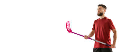 Portrait of young man, floorball player with floorball stick isolated on white background. Sport, competition and motion, movement, active lifestyleの写真素材