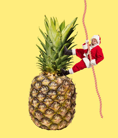 Contemporary art collage. Creative design with joyful senior man in image of Santa Claus climbing up...
