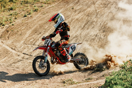 Dnipro, Ukraine JULY 01, 2022. Ukrainian beginner motorcycle rider driving on Enduro motorbike, outdoors at hot summer day. Kids motocross trainingのeditorial素材