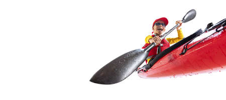 Beginner kayaker in red canoe, kayak with a life vest and a paddle isolated on white background. Concept of sport, nature, travel, active lifestyleの写真素材