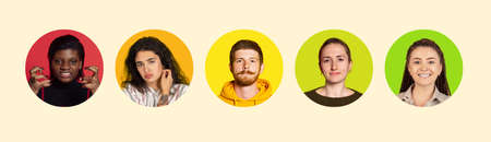 Multi ethnic youth. Set of round icons with young male and female faces expressing emotions isolated on colored background. Flyer, bannerの写真素材