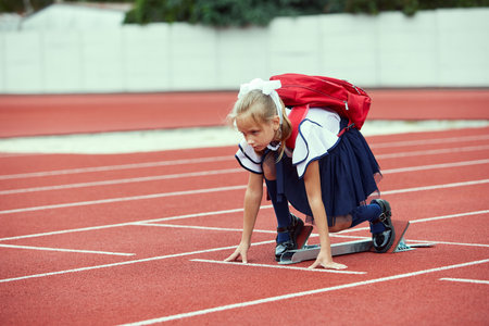 Start. Back to school, kids and education concept. Girl dressed in school uniform as elementary...