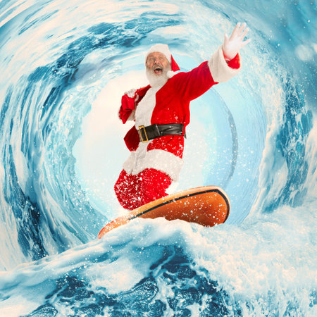 Emotional thrilled Santa Clause surfing on huge wave in ocean or sea. Design for greeting card. Exotic tropical winter, Christmas holidays, happiness, dreamsの写真素材