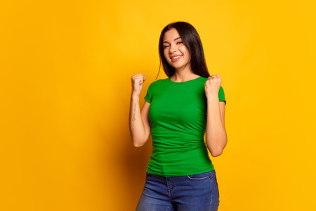 Surprise. Winning success happy woman celebrating being a winner. Image of caucasian female model on studio background. Victory, delight concept. Human facial emotions concept.の写真素材
