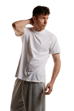 Mature man posing in shirt and pants over white studio background. Comfortable homewear. Looking serious and brutal. Mens health and beautyの写真素材