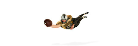 Man, american football player in motion, training, catching ball in a jump over white studio...