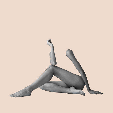 Body art, aesthetics. Human beauty. Silhouette, female body part, legs and hands isolated over light pastel backgroundの写真素材