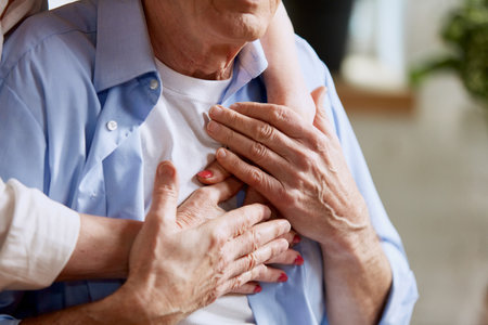 Cropped image of lovely retired couple, middle-aged, old woman hugging her husband, giving love and support to manの写真素材