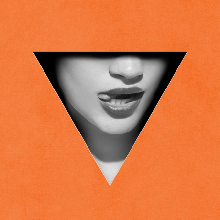 Sensuality. Black and white image of cropped female face part, lips and nose in triangle shape against orange background. Contemporary art collage. Conceptual design.の写真素材