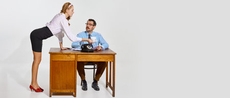 Female employee serving coffee. Businessman and woman, personal assistant over grey background. Concept of business, employment, workの写真素材