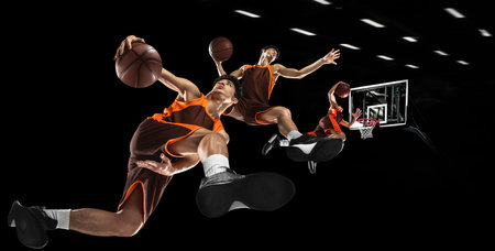 Creative collage. Competition. Young man, professional basketball player in uniform jumping with ball over black backgroundの写真素材