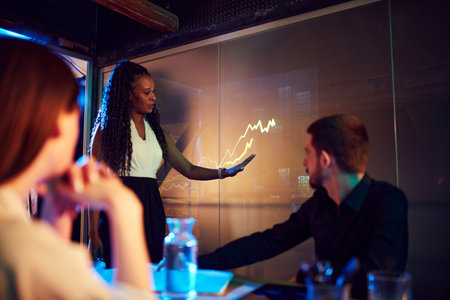 E-commerce. Business woman leading presentation during business meeting, conference with colleagues. Digital screenの写真素材